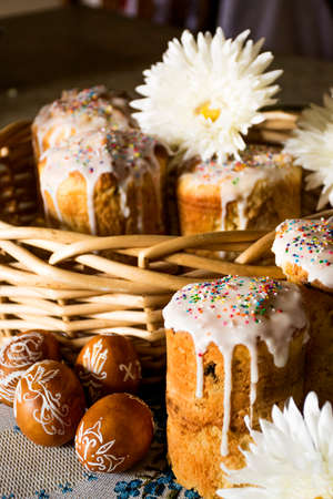 Easter bread in basket with white flowers.