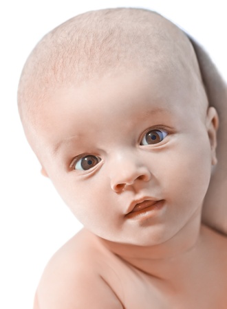 Portrait of a small beautiful baby on whiteの写真素材