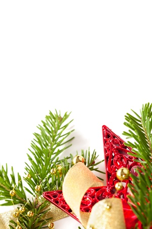 Christmas seasonal background with spruce and golden beads isolatedの写真素材