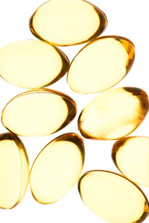 Yellow pills isolated backgroundの写真素材