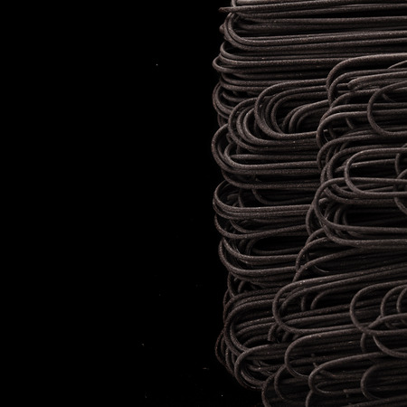 Black italian raw pasta backgroundの写真素材