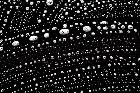 Foam bubbles abstract dark backgroundの写真素材