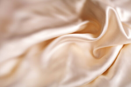Abstract soft golden fabric backgroundの写真素材