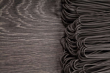 Black italian raw pasta backgroundの写真素材