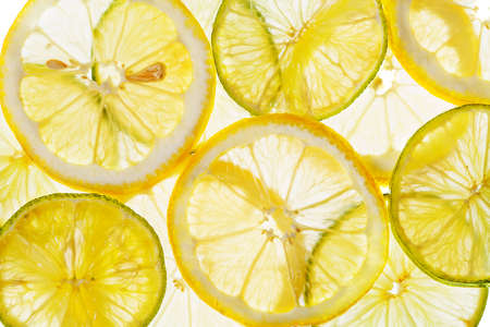 Citrus slices fresh fruit yellow green backgroundの写真素材