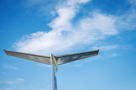 Airplane retro vintage tail detail on blue skyの写真素材