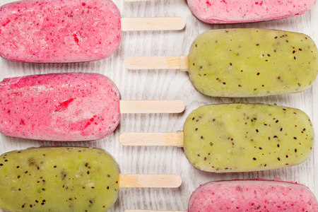 Popslices icecream  assortment on light wooden backgroundの写真素材