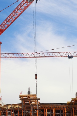 The crane elevating against the blue sky の写真素材
