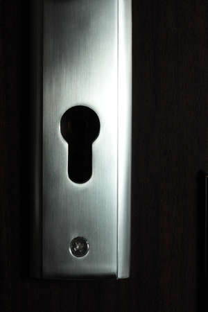 Door  keyhole dark background, nobodyの写真素材