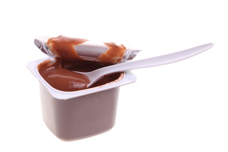 chocolate dessert and teaspoon isolated on whiteの写真素材