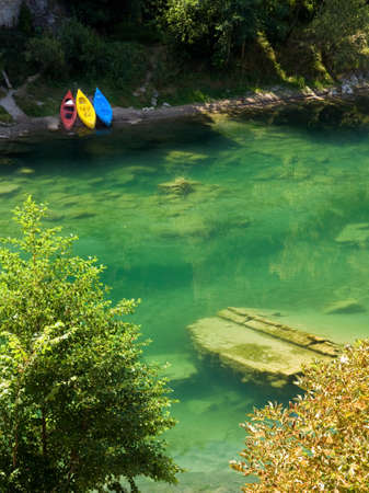 coloured kayaks, coast green riverの写真素材
