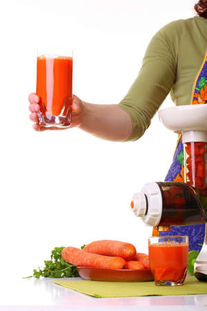 Woman Juice extractor and carrot isolated white kitchen prepareの写真素材