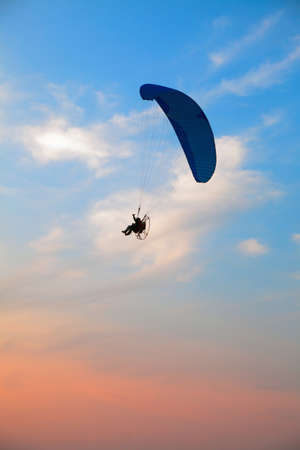 Paraglider - Feeling free on the sunset skyの写真素材
