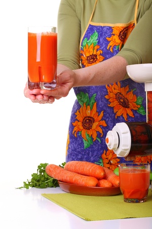 Woman Juice extractor and carrot isolated white kitchen prepareの写真素材