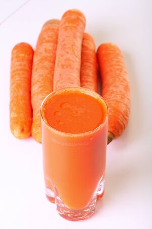 Juice and carrot isolated white kitchen prepareの写真素材