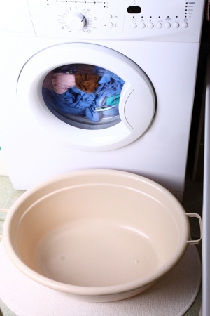 towels in washing machine cloths indoor bathroomの写真素材