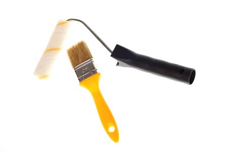 Paintbrush yellow over white isolated backgroundの写真素材