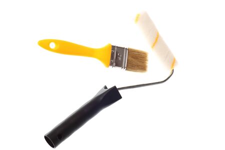 Paintbrush yellow over white isolated backgroundの写真素材
