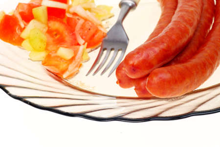salad sausage on plate isolated white backgroundの写真素材