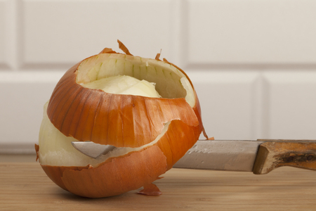 Chef cooking with vagetables over wooden tableの写真素材