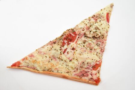 A triangular piece of square pizza with sausage and tomatoes on a white backgroundの写真素材