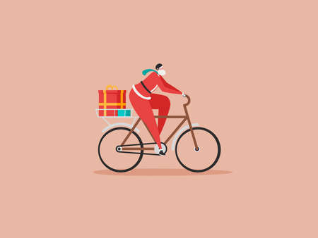 Merry Christmas, The New Year, Happy Holidays concept. The young man or Santa Claus rides a bicycle...