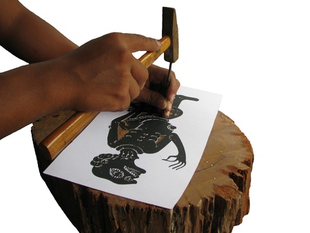 Training make shadow play puppet step that to drive a wedge into paperの写真素材