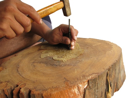 Making shadow play puppet step that to drive a wedge into leather