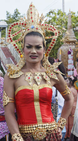 NAKHON SI THAMMARAT, THAILAND - SEPTEMBER 26: Woman with Thai dress in Tenth Lunar Month Festival...