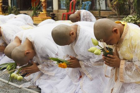 Nakhon Si Thammarat, Thailand - December 02, 2011 : Celebration of candidate Buddhist novice during ordination ceremony to offer prayers for the King Bhumibol Adulyadej at Wat Srareang, Nakhon Si Thammarat, Thailandのeditorial素材