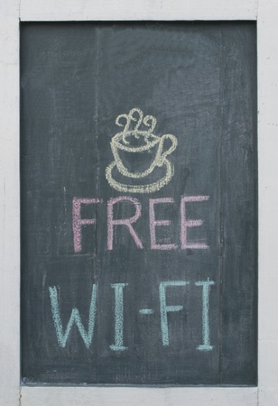 Free Wi-Fi chalk text written on blackboard at restaurantの写真素材