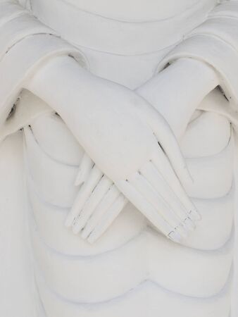 Folded hand of Buddha at temple in Thailandの写真素材
