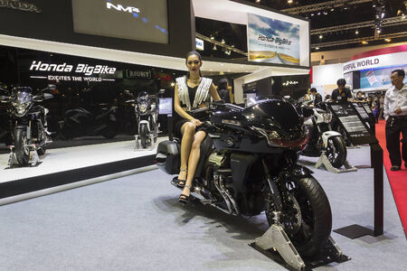 BANGKOK - APRIL 2 : Unidentified lady posts at the Honda CTX1300 motorcycle on display at The 35th...