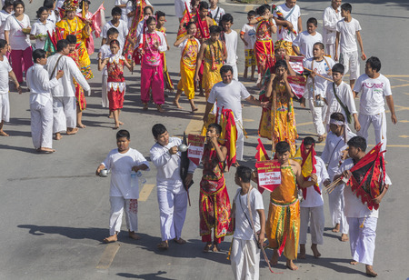 NAKHON SI THAMMARAT, THAILAND - OCTOBER 25: Taoist devotees participate in a street procession of the Nakhon Si Thammarat vegetarian festival on October 25, 2014 in Nakhon Si Thammarat province, Thailand. The festival was celebrated to make merit and saveのeditorial素材