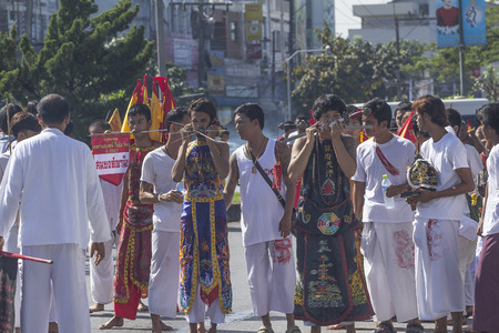 NAKHON SI THAMMARAT, THAILAND - OCTOBER 25: Taoist devotees participate in a street procession of...