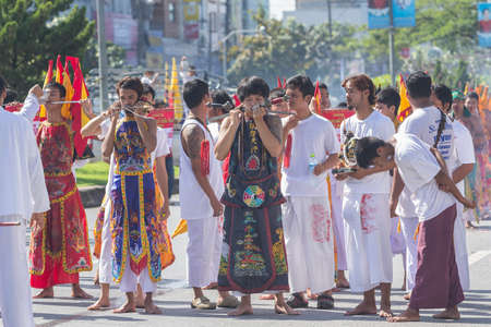NAKHON SI THAMMARAT, THAILAND - OCTOBER 25: Taoist devotees participate in a street procession of the Nakhon Si Thammarat vegetarian festival on October 25, 2014 in Nakhon Si Thammarat province, Thailand. The festival was celebrated to make merit and saveのeditorial素材