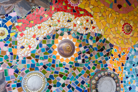 PHETCHABUN ,THAILAND - JANUARY 4 : Colorful ceramic pattern decoration with pebbles made from pebble and ceramic on the wall at Wat Phasornkaew on January 4, 2015 in Phetchabun, Thailand.のeditorial素材