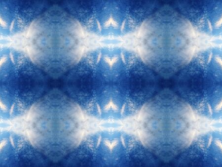 Abstract kaleidoscopic texture or background pattern design made from blue sky with cloud