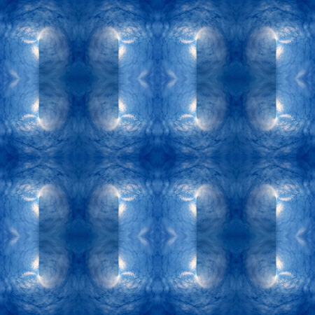Abstract kaleidoscopic texture or background pattern design made from blue sky with cloud