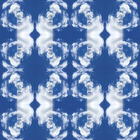 Abstract kaleidoscopic texture or background pattern design made from blue sky with cloudの写真素材
