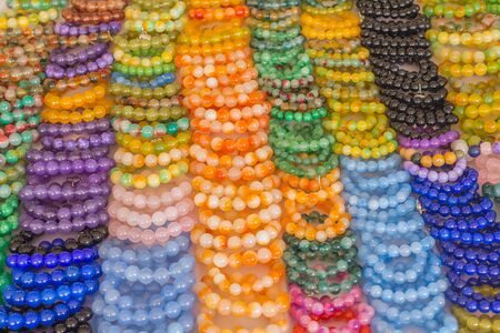Round stone bracelet and glass beads fashion backgroundの写真素材