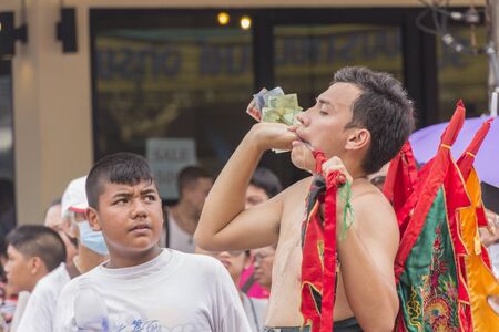 KRABI, THAILAND - OCTOBER 4: Taoist devotees participate at street procession of Krabi vegetarian festival on October 4, 2016 in Ktabi, Thailand.のeditorial素材