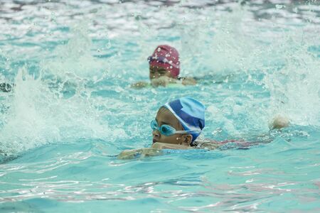 NAKHON SI THAMMARAT, THAILAND - MARCH 2: Asian Thai children in the swimming pool at the leisure center on March 2, 2016 in Nakhon Si Thammarat, Thailand.のeditorial素材