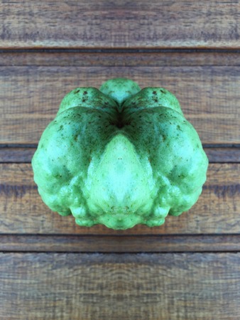 Green guava fruit on wood backgroundの写真素材