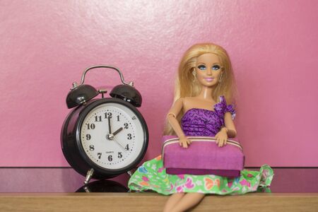 Krabi, Thailand - October 5, 2017: Barbie doll sitting on wood table.