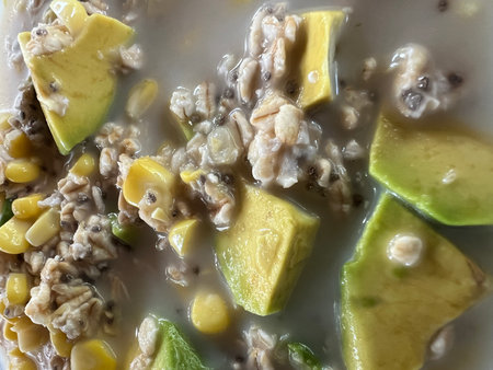 Oatmeal porridge with Avocado and Chia seeds in a bowl.