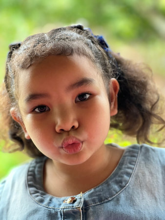 Portrait of a cute little Asian girlの写真素材