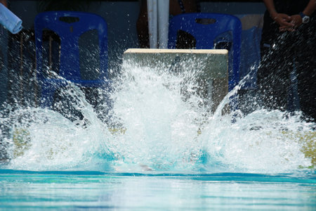 Closeup water splash in the swimming poolの写真素材