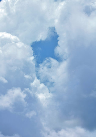 Closeup blue sky with white clouds, natural background with copy spaceの写真素材