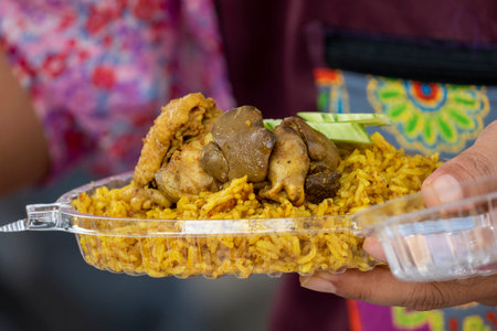 Pilaf chicken pieces with vegetables and rice on the street market of Thailand, Asian foodの写真素材